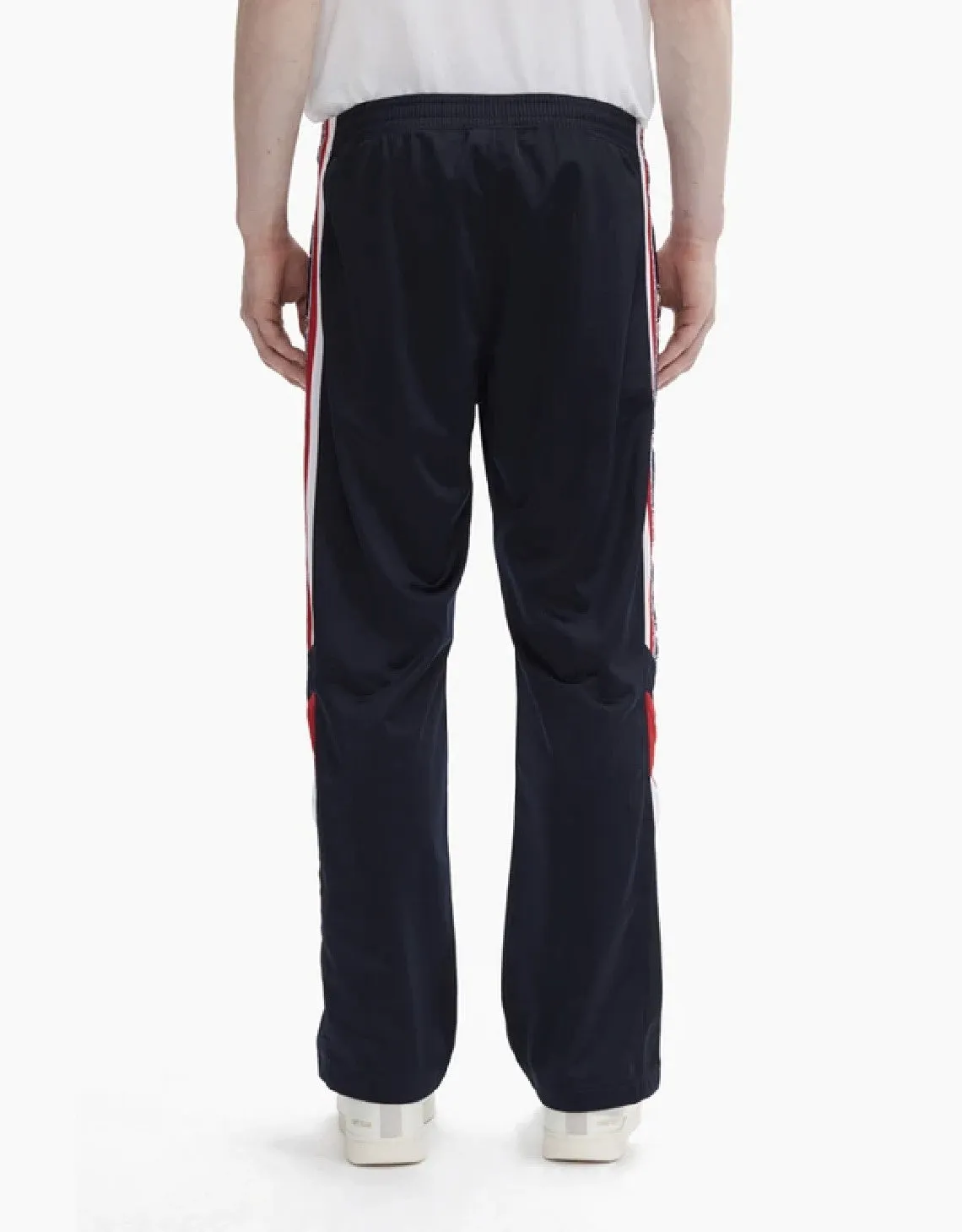 CHAMPION EUROPE<br>ARCHIVE JACQUARD LOGO TAPE TRACK PANTS NAVY