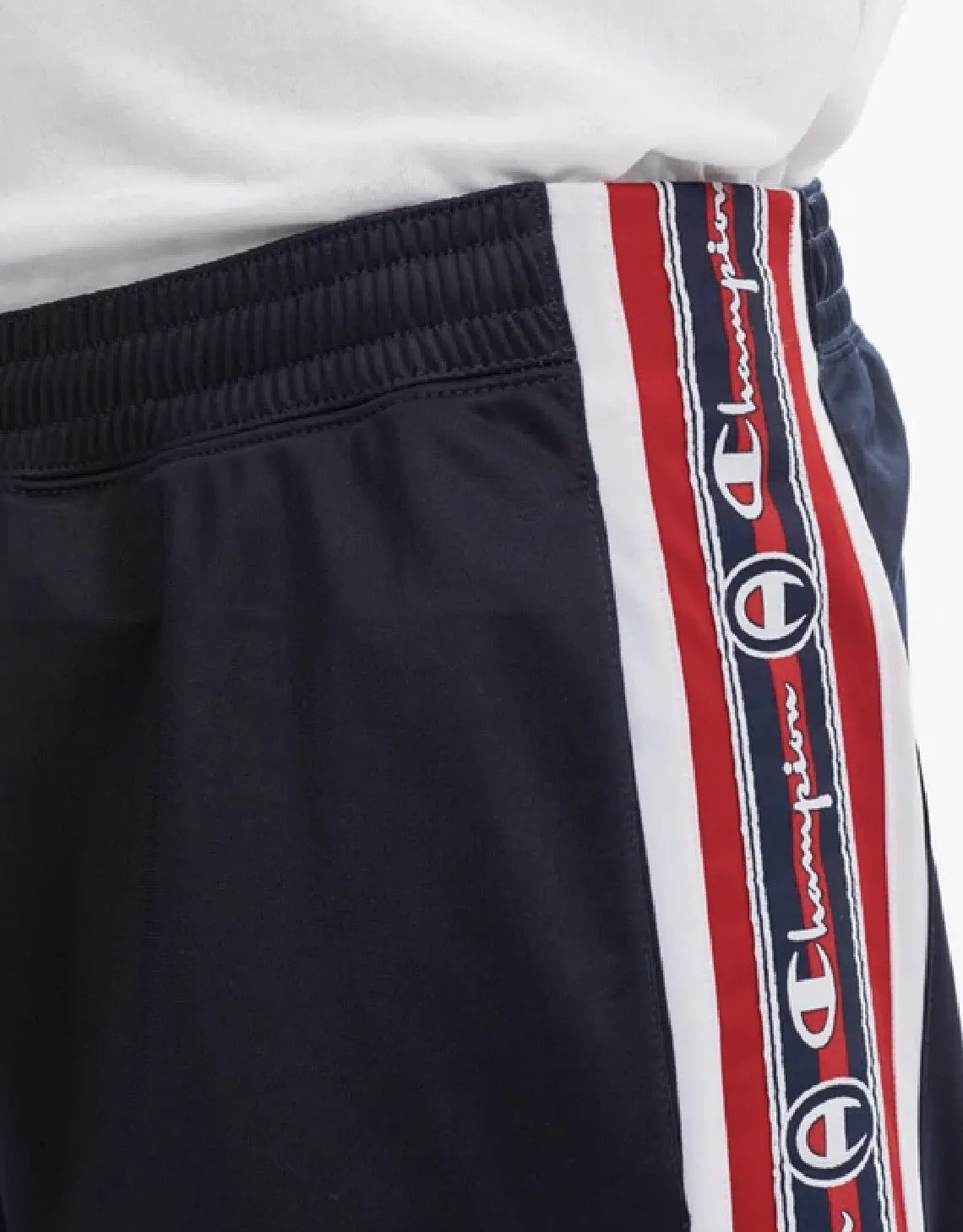 CHAMPION EUROPE<br>ARCHIVE JACQUARD LOGO TAPE TRACK PANTS NAVY