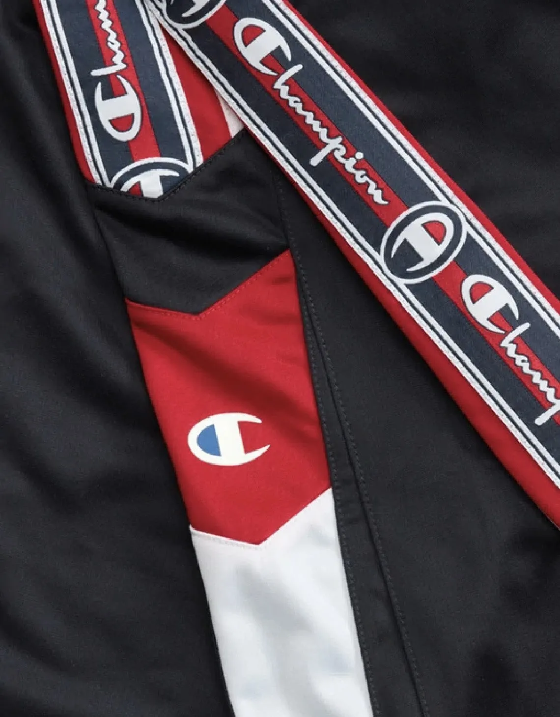 CHAMPION EUROPE<br>ARCHIVE JACQUARD LOGO TAPE TRACK PANTS NAVY